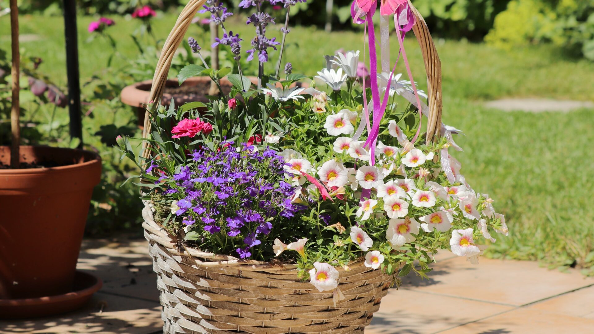 basket full of assorted flowers