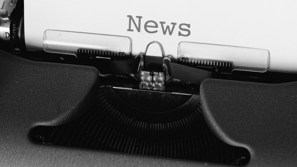 black and white typewriter on black table