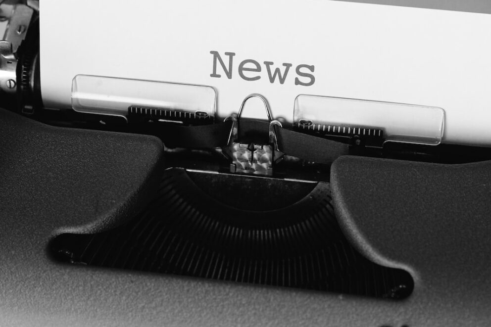 black and white typewriter on black table