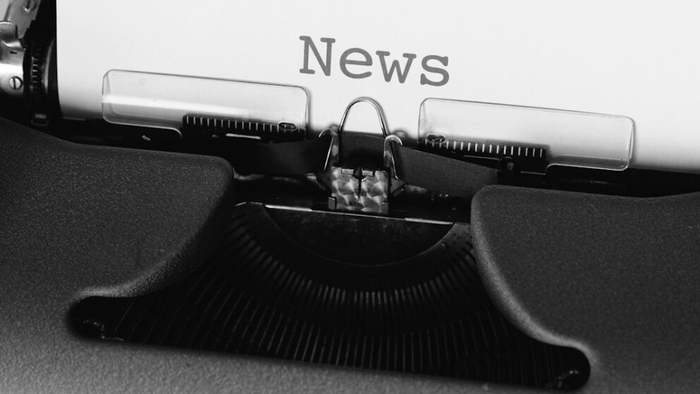 black and white typewriter on black table